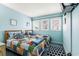 Cozy bedroom featuring two twin beds, bright blue walls, patterned bedding, and natural light for a relaxing stay at 5905 South Kings Hwy. # 4219-D, Myrtle Beach, SC 29575