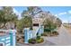 The sign to the resort with palm trees and well manicured landscaping welcomes you at 5905 South Kings Hwy. # 4219-D, Myrtle Beach, SC 29575