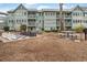Exterior view showcasing a community area with a giant chessboard and picnic tables, perfect for outdoor gatherings at 5905 South Kings Hwy. # 4219-D, Myrtle Beach, SC 29575