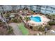 Aerial view of outdoor pool and amenity area with tables, chairs, barbecue and walking path at 5905 South Kings Hwy. # 4219-D, Myrtle Beach, SC 29575
