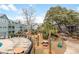 View of the pool and courtyard with picnic tables, grills, and palm trees in a condominium complex at 5905 South Kings Hwy. # 4219-D, Myrtle Beach, SC 29575