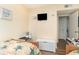 Cozy bedroom featuring two beds, a wall-mounted TV, and ample lighting for a comfortable space at 5905 South Kings Hwy. # 4107-D, Myrtle Beach, SC 29575