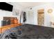 Comfortable bedroom featuring a black comforter, TV, and access to a nearby bathroom for added convenience at 5905 South Kings Hwy. # 4107-D, Myrtle Beach, SC 29575