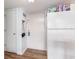 Entryway with white appliances, including a refrigerator, and an adjacent door for storage or utilities at 5905 South Kings Hwy. # 4107-D, Myrtle Beach, SC 29575
