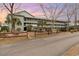 Three-story building showcasing multiple balconies with scenic views, surrounded by mature trees and meticulous landscaping at 5905 South Kings Hwy. # 4107-D, Myrtle Beach, SC 29575