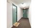 Hallway features a 'Welcome-ISH' doormat, neutral carpet and leads to an exit at 5905 South Kings Hwy. # 4107-D, Myrtle Beach, SC 29575