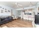 Open-concept living room and kitchen area, featuring wood floors and natural light from the windows at 5905 South Kings Hwy. # 4107-D, Myrtle Beach, SC 29575