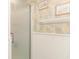 Bathroom featuring a glass shower door, complemented by elegant wallpaper and modern fixtures at 5905 South Kings Hwy. # 4107-D, Myrtle Beach, SC 29575