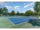 Bright outdoor tennis courts featuring blue and green surfaces and surrounding greenery at 5905 South Kings Hwy. # 4107-D, Myrtle Beach, SC 29575