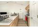 Functional kitchen features white appliances, ample counter space, and wood-look floors at 597 Blue River Ct. # H2, Myrtle Beach, SC 29579