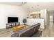 Cozy living space with a futon, television, and a convenient pass-through to the kitchen at 597 Blue River Ct. # H2, Myrtle Beach, SC 29579