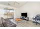 Bright living room with lake views, comfortable seating, and modern entertainment setup at 597 Blue River Ct. # H2, Myrtle Beach, SC 29579