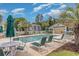 Community pool area with plenty of chairs, umbrellas, and a view of the surrounding landscaping at 597 Blue River Ct. # H2, Myrtle Beach, SC 29579