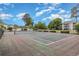 Well maintained community tennis court surrounded by lush greenery and nearby buildings at 597 Blue River Ct. # H2, Myrtle Beach, SC 29579