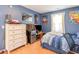 Blue bedroom with hardwood floors, a mini-fridge, and a single bed at 6006 Quinn Rd., Myrtle Beach, SC 29579