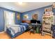 Fun and inviting blue bedroom with desk and other furniture at 6006 Quinn Rd., Myrtle Beach, SC 29579