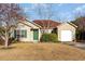 Charming single-story home with green shutters and a well-maintained front lawn at 6006 Quinn Rd., Myrtle Beach, SC 29579