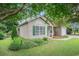 Charming single-story home with green shutters, lush landscaping and inviting curb appeal at 6006 Quinn Rd., Myrtle Beach, SC 29579