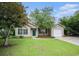Inviting single story home with a well manicured lawn, attached garage and mature shade tree at 6006 Quinn Rd., Myrtle Beach, SC 29579