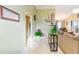 Inviting hallway with tiled floors, decorative accents, and a view into the living area at 6006 Quinn Rd., Myrtle Beach, SC 29579
