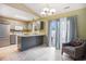 Kitchen featuring updated gray cabinets, granite counters, and stainless steel appliances at 6006 Quinn Rd., Myrtle Beach, SC 29579