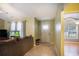 The living room featuring tiled floors and a cozy seating area and neutral walls at 6006 Quinn Rd., Myrtle Beach, SC 29579