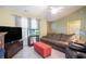 A cozy living room features a plush sofa, soft lighting and large television at 6006 Quinn Rd., Myrtle Beach, SC 29579