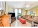 Spacious living area with a fireplace, television, and comfortable sectional sofa at 6006 Quinn Rd., Myrtle Beach, SC 29579