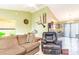 Open-concept living area with views to the kitchen and outdoor patio at 6006 Quinn Rd., Myrtle Beach, SC 29579