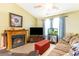 Bright living room with a fireplace, television, and plenty of natural light at 6006 Quinn Rd., Myrtle Beach, SC 29579