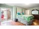 Cozy main bedroom featuring a four poster bed, hardwood floors, and patio access at 6006 Quinn Rd., Myrtle Beach, SC 29579