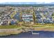 Aerial view of a community with a large pool, clubhouse, lake, and waterfront access at 6069 Tramonto St., Myrtle Beach, SC 29572