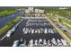 Marina aerial view showcasing yachts, boat slips, and the waterway with buildings in background at 6069 Tramonto St., Myrtle Beach, SC 29572
