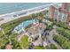 Beautiful aerial view of beachfront condos, clubhouse, swimming pools, and beach access at 6069 Tramonto St., Myrtle Beach, SC 29572