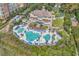 Aerial view of clubhouse with pools and lounge chairs for relaxing by the ocean at 6069 Tramonto St., Myrtle Beach, SC 29572
