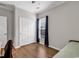 Well-lit bedroom features hardwood floors, a closet, and a window with views of the outdoors at 6069 Tramonto St., Myrtle Beach, SC 29572