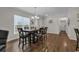 Bright dining room with hardwood floors, large windows, and stylish furnishings at 6069 Tramonto St., Myrtle Beach, SC 29572