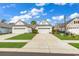 Charming single-story home featuring a two-car garage, manicured lawn, and beautiful landscaping at 6069 Tramonto St., Myrtle Beach, SC 29572