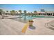 Gorgeous outdoor pool area with palm trees, lounge chairs, and shallow water for relaxing at 6069 Tramonto St., Myrtle Beach, SC 29572