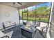 Inviting screened-in patio with comfortable seating and a cozy fire pit at 6069 Tramonto St., Myrtle Beach, SC 29572