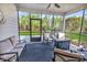 Inviting screened-in patio with comfortable seating and a cozy fire pit at 6069 Tramonto St., Myrtle Beach, SC 29572