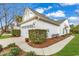 A side view of the home showcasing its well-maintained landscaping and classic architectural details at 6069 Tramonto St., Myrtle Beach, SC 29572