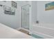 Bright bathroom showing the soaking tub, glass shower, and decor featuring blue walls and tile flooring at 6203 Catalina Dr. # 2316, North Myrtle Beach, SC 29582