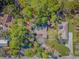 Aerial view shows home nestled among lush greenery with surrounding neighborhood at 67 Massick Ln., Pawleys Island, SC 29585