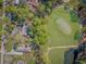 Aerial shot of a home near a golf course with pond and lush landscaping at 67 Massick Ln., Pawleys Island, SC 29585