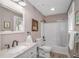 Cozy bathroom features a white vanity with marble countertop and shower-tub combination at 67 Massick Ln., Pawleys Island, SC 29585