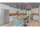 Modern kitchen with white cabinetry, stainless steel appliances, and a central island with bar seating at 67 Massick Ln., Pawleys Island, SC 29585