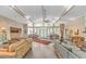 Bright living area boasting beamed ceilings, large windows, and a seamless transition to the outdoor space at 67 Massick Ln., Pawleys Island, SC 29585