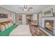 The main bedroom boasts a fireplace, ceiling fan, and a view into the dining room at 67 Massick Ln., Pawleys Island, SC 29585