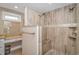 An elegant walk-in shower features a granite bench and tile walls at 67 Massick Ln., Pawleys Island, SC 29585